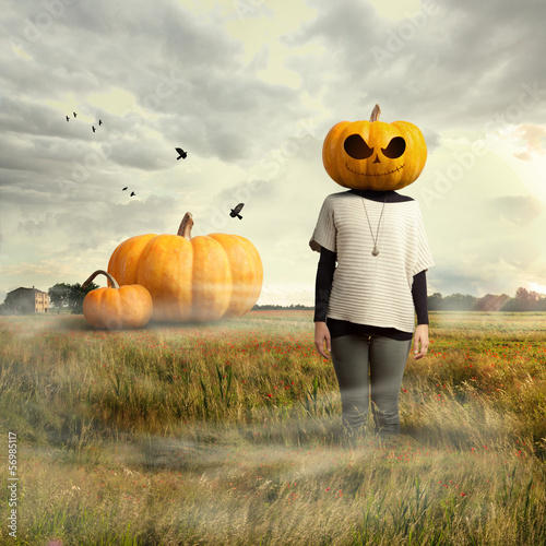 Young girl with pumpkin head, halloween
