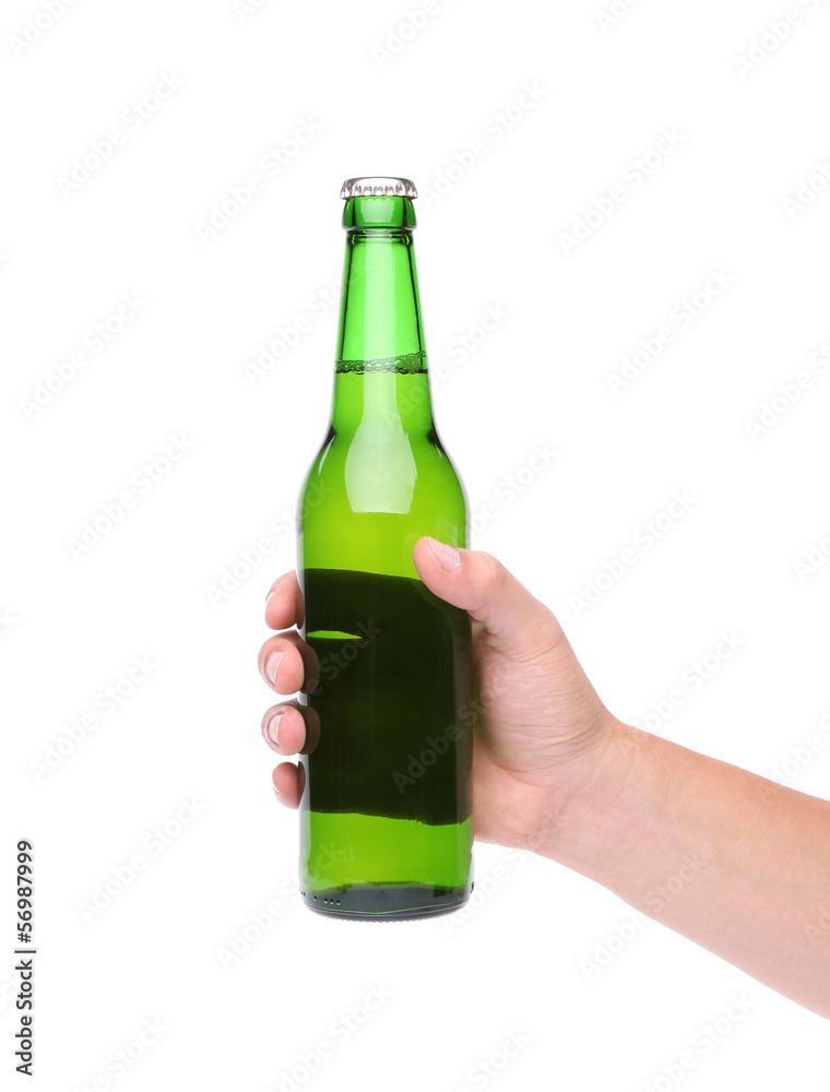 Hand holding up a green beer bottle Hand holding up a green beer bottle