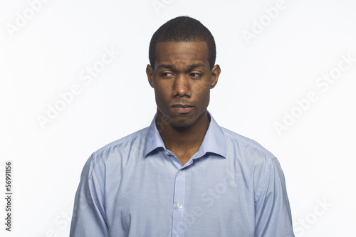 Young African American man looking ashamed or sad © Burlingham