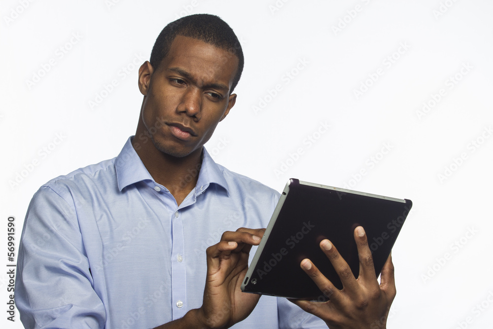 Young black man using electronic tablet, horizontal Young black man using electronic tablet, horizontal