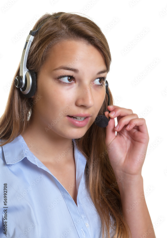 Beautiful female operator talking at phone Beautiful female operator talking at phone