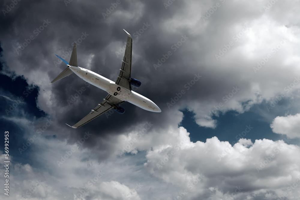 Obraz premium Airplane at fly on the sky with clouds