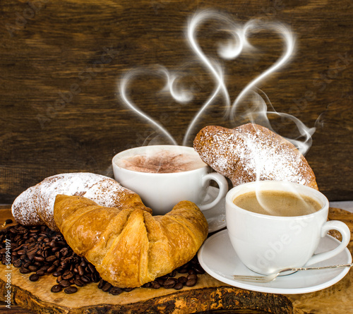 Fototapeta Naklejka Na Ścianę i Meble -  Croissants and coffee with heart- shaped steam