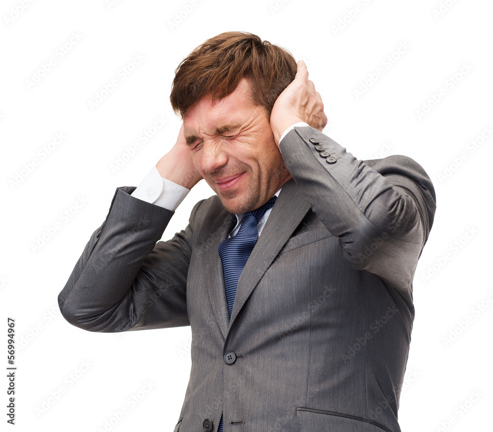 stressed buisnessman or teacher closing ears stressed buisnessman or teacher closing ears