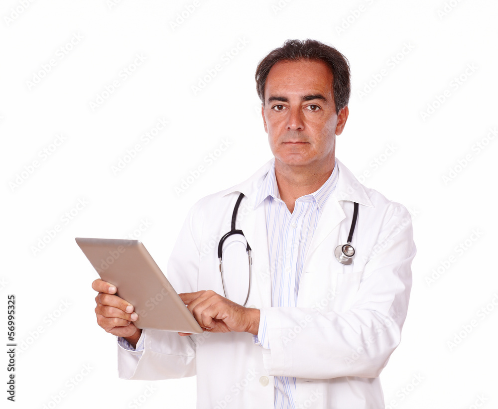 Handsome medical doctor using his tablet pc Handsome medical doctor using his tablet pc
