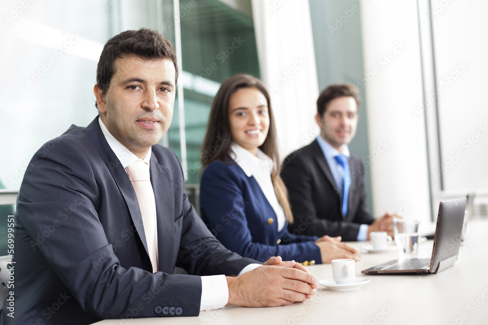 Business team smiling at the office, lined up Business team smiling at the office, lined up