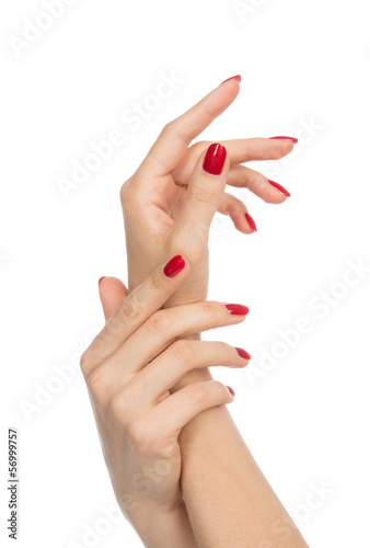 Woman hands with manicured red nails