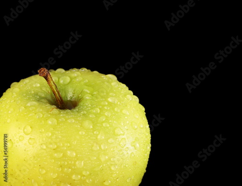 Apple  with water drops  isolated on black