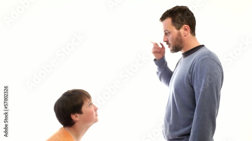 Father arguing, son shrinking