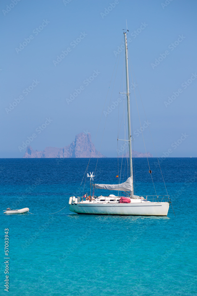 Es Vedra background with sailboat from Formentera Es Vedra background with sailboat from Formentera
