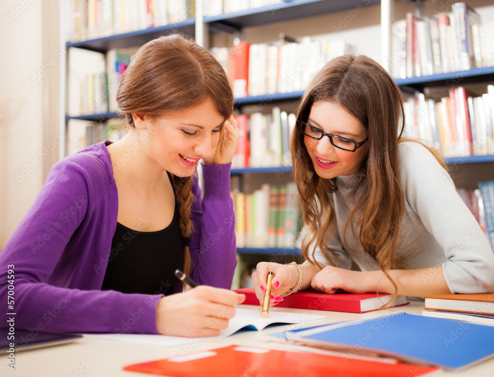 Students in a library Students in a library