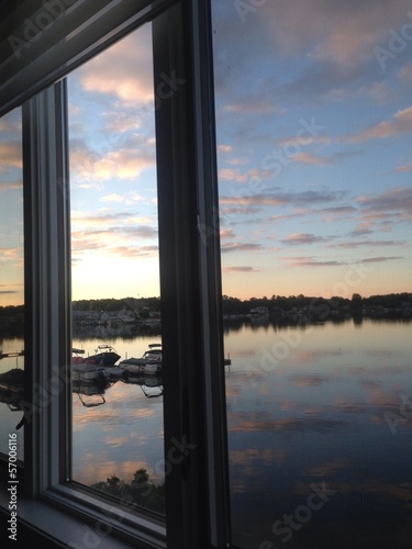 Windows overlooking Boats with Beautiful Sunrise