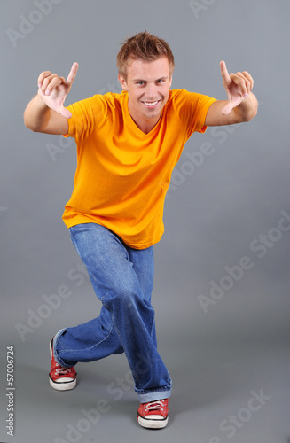 Handsome young man dancing ...