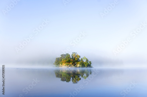 small island in foggy morning