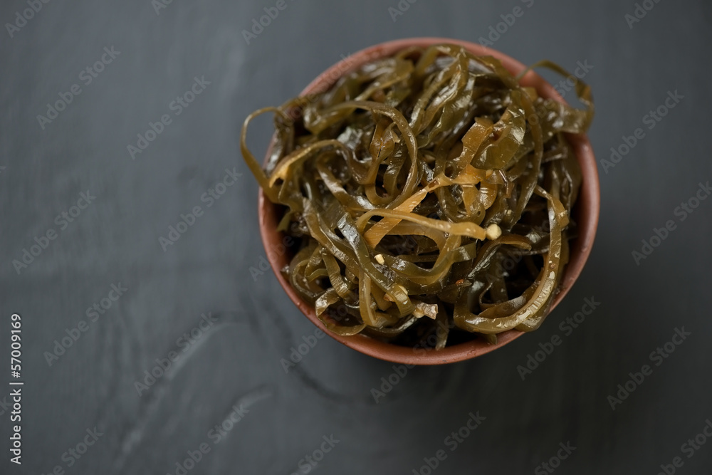 Ceramic bowl with sea kale, view from above Ceramic bowl with sea kale, view from above