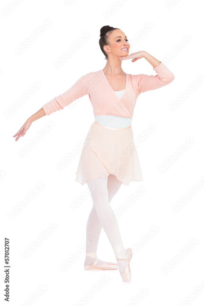 Happy attractive ballerina posing looking away Happy attractive ballerina posing looking away