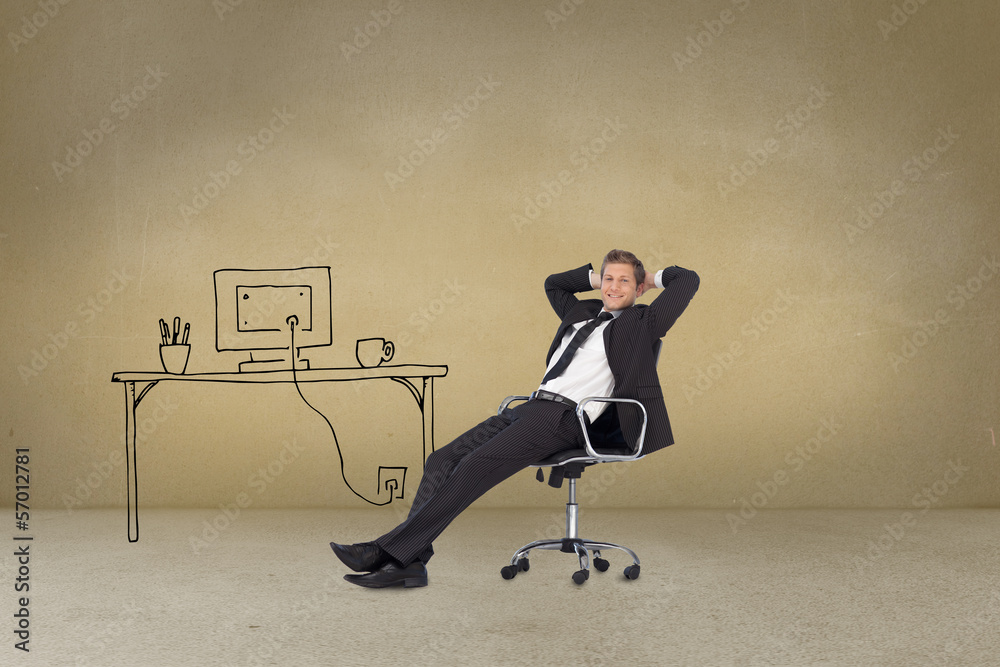 Businessman sitting cross armed next to painted desk