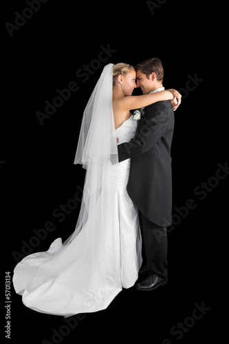 Sweet young couple posing hugging each other