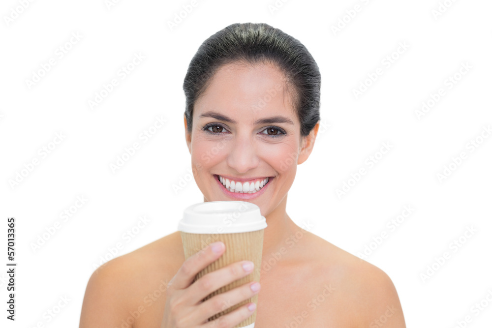 Smiling bare brunette holding disposable cup Smiling bare brunette holding disposable cup