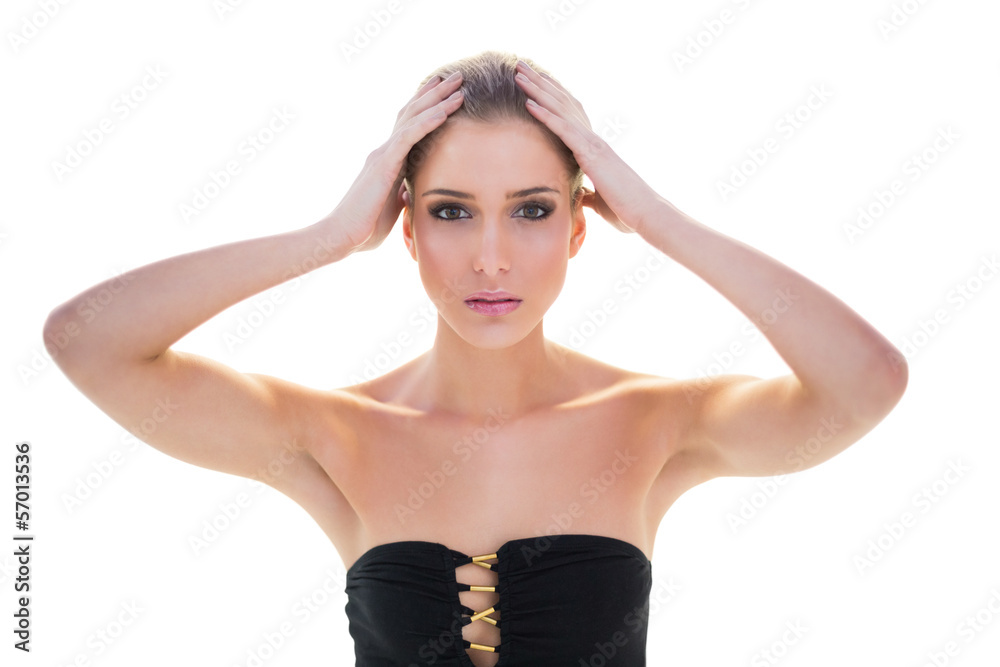 Fototapeta premium Serious attractive blonde model holding her head