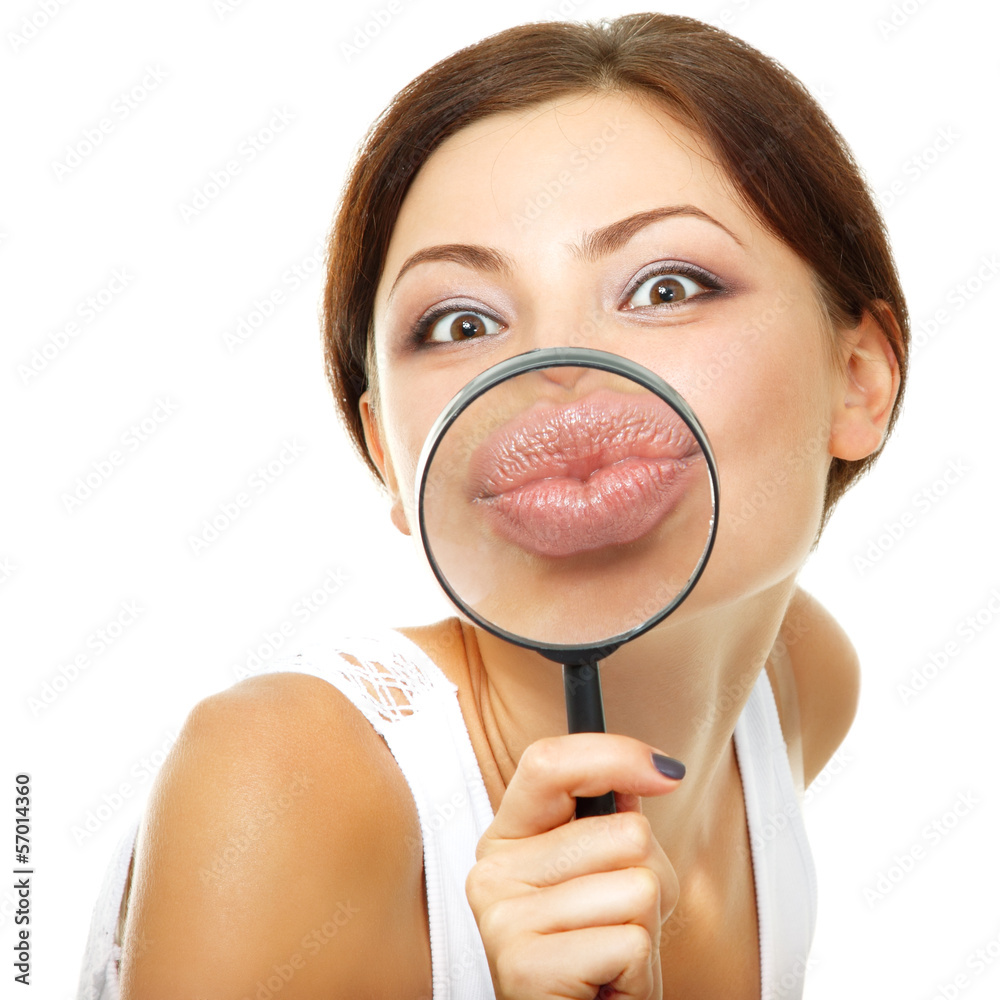 attractive young woman give kiss through a magnifying glass over attractive young woman give kiss through a magnifying glass over