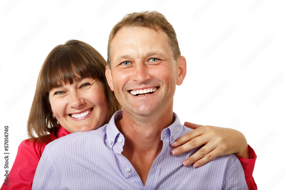 Attractive cheerful woman with man in love smiling over white ba Attractive cheerful woman with man in love smiling over white ba