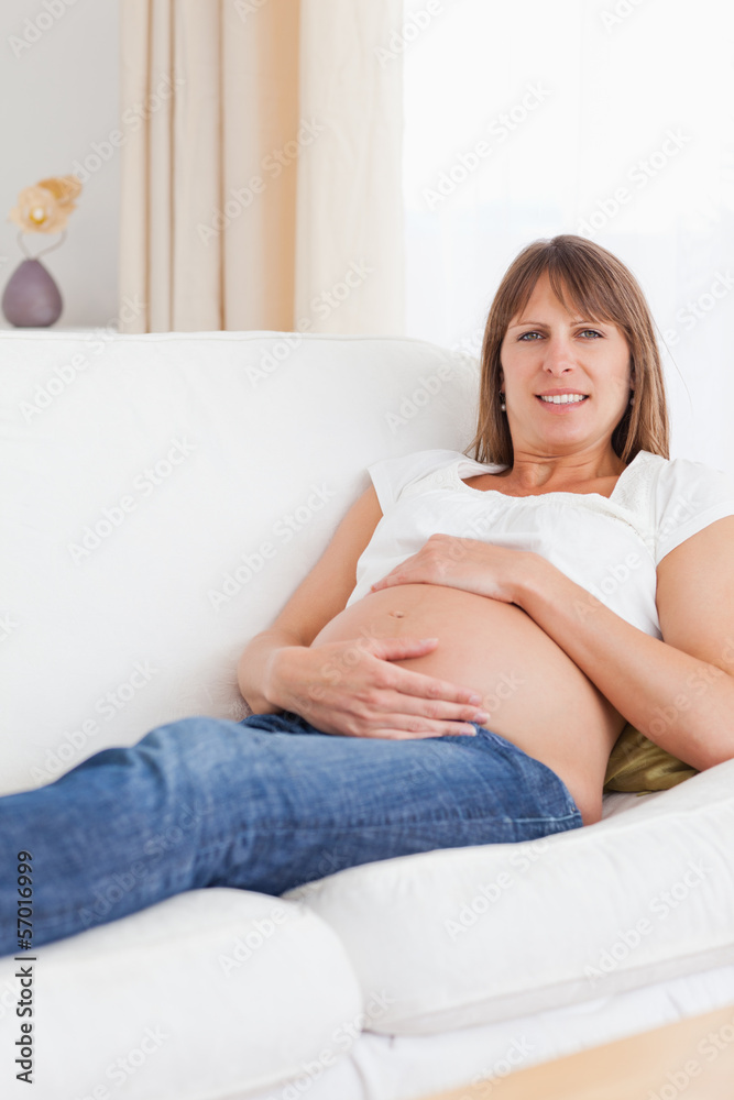 Portrait of a pregnant woman holding her belly Portrait of a pregnant woman holding her belly