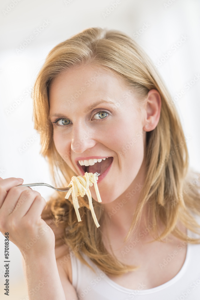 Close-Up Of Woman Eating Pasta At Home Close-Up Of Woman Eating Pasta At Home