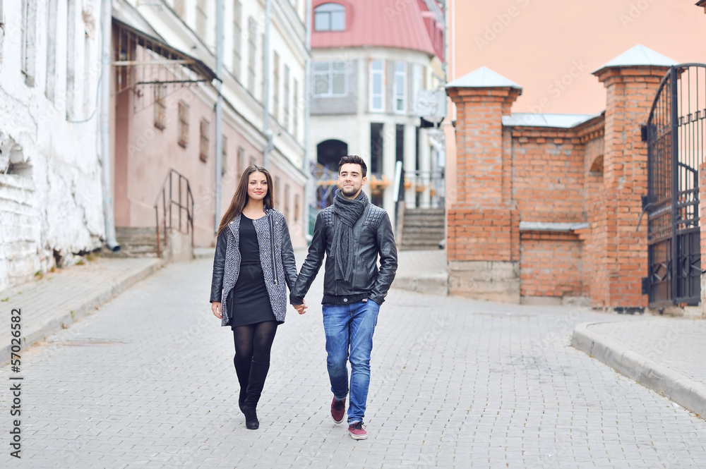 Young couple walking in an old town