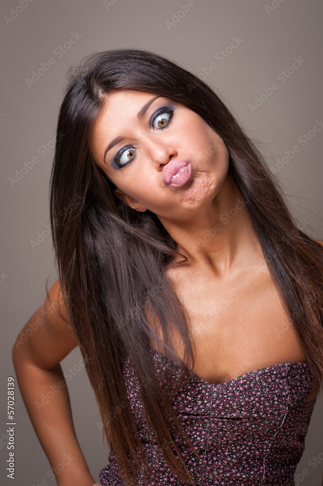 Brunette woman portrait with crazy expression. Brunette woman portrait with crazy expression.