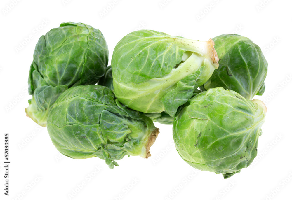 A group of fresh Brussels sprouts on a white background A group of fresh Brussels sprouts on a white background