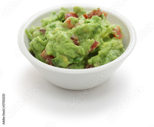 guacamole dip in bowl isolated on white background