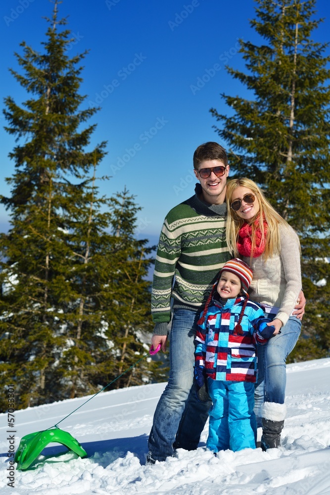 Obraz premium family having fun on fresh snow at winter