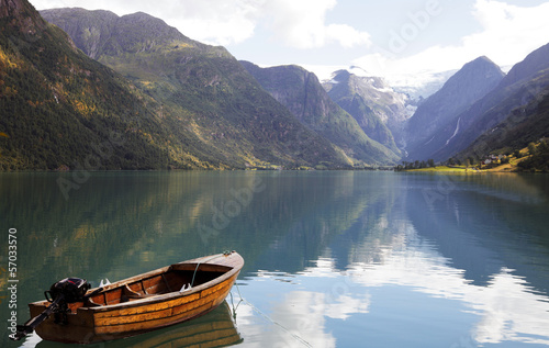 Fototapeta Naklejka Na Ścianę i Meble -  Fishing boat on a still lake in Norway