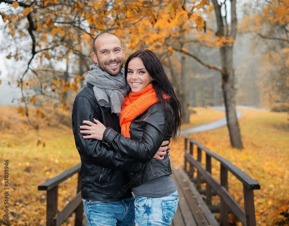 Fototapeta premium Happy middle-aged couple outdoors on beautiful autumn day