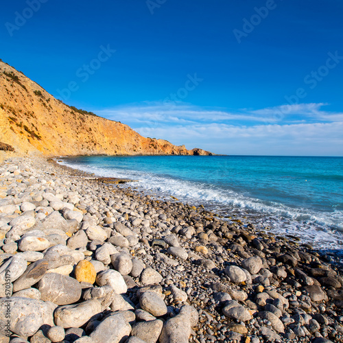 Ibiza Cala Jondal Beach with rolling stones in san Jose