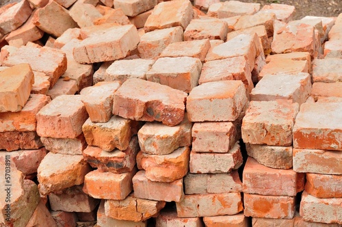 Stack of old used bricks