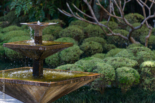 Square fountain in an Asian garden