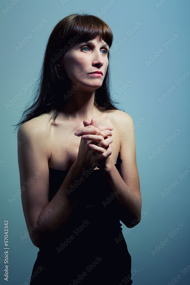 Fototapeta premium mature woman prays