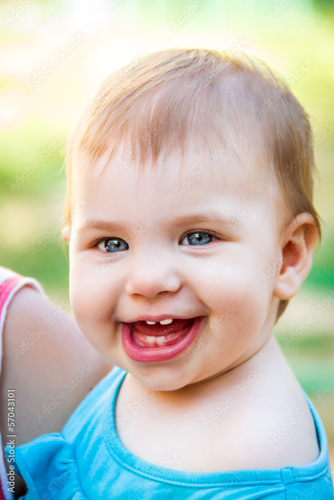 Adorable, laughing baby looking at camera Adorable, laughing baby looking at camera