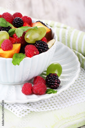 Fruit salad in bowl  on wooden background