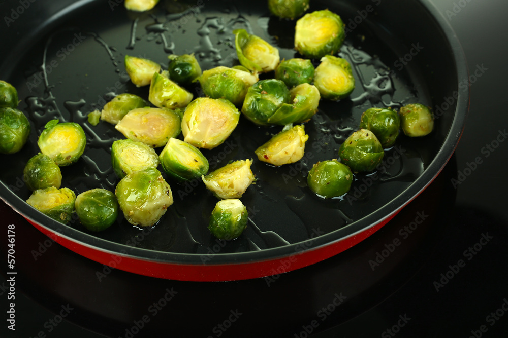 Fresh brussels sprouts in pan on cooking surface close-up Fresh brussels sprouts in pan on cooking surface close-up