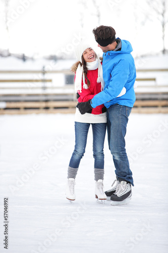 Ice skating couple on date in love iceskating