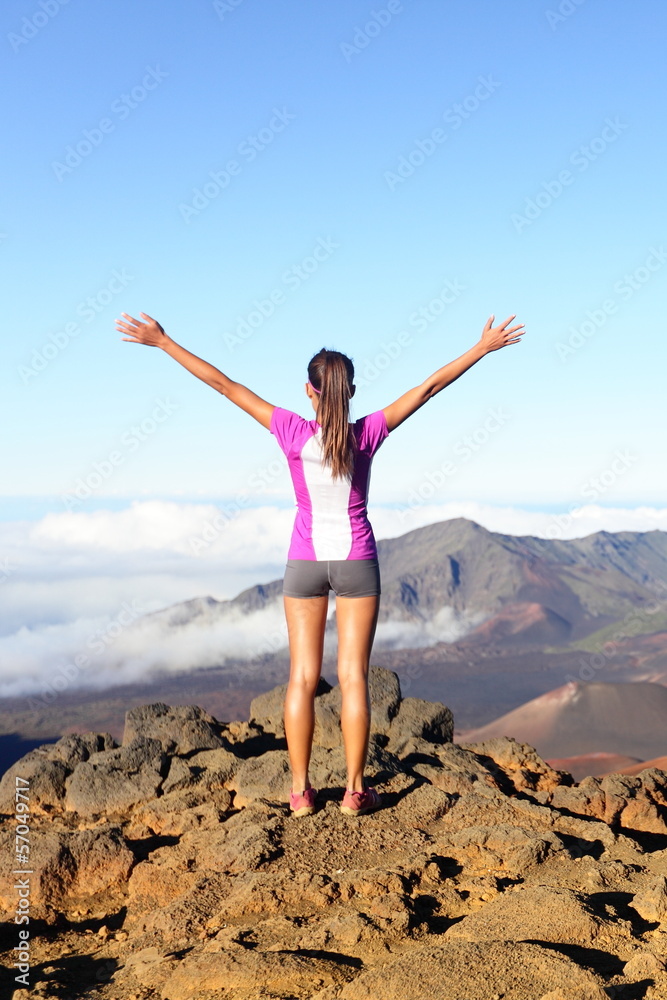 Success and achievement - hiking woman on top Success and achievement - hiking woman on top