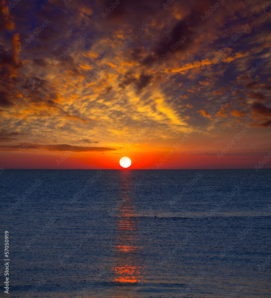 Sunset at Mediterranean sea with orange sky