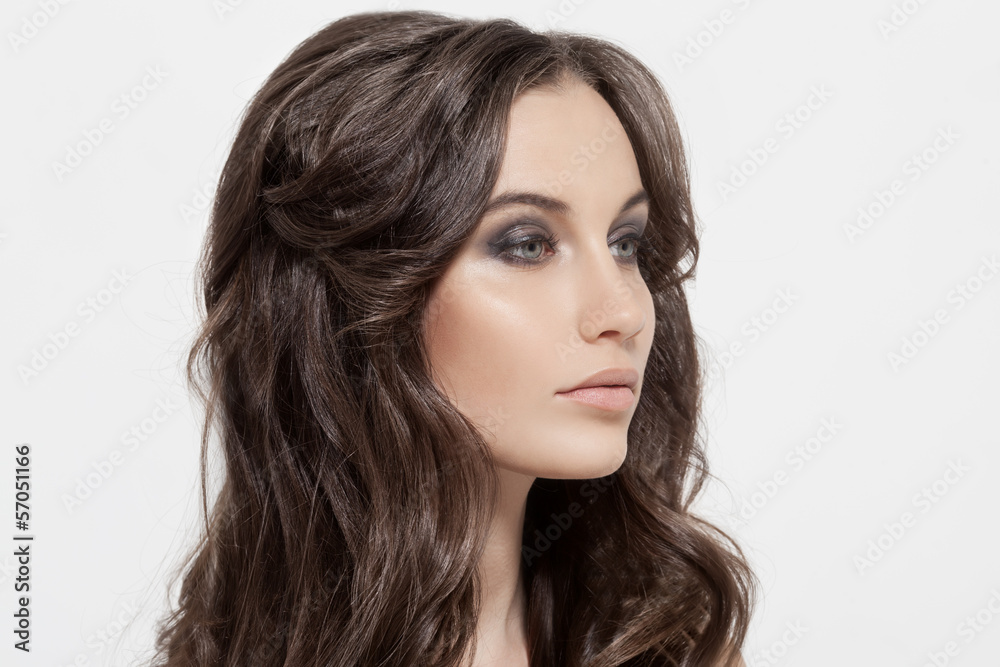 Beautiful Brunette Girl. Healthy Long Curly Hair.