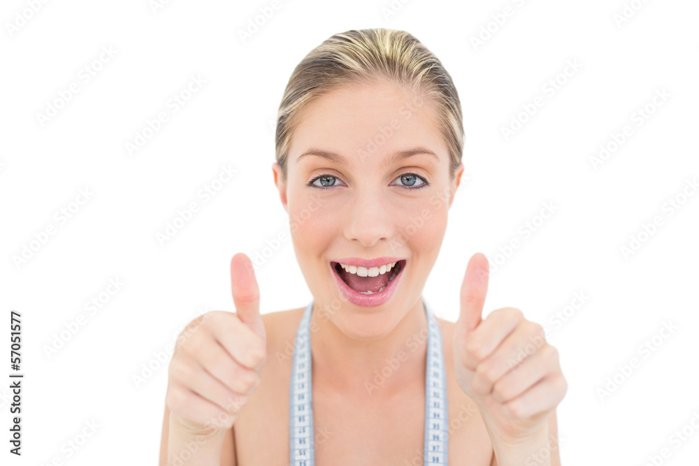 Delighted fresh blonde woman giving thumbs up Delighted fresh blonde woman giving thumbs up