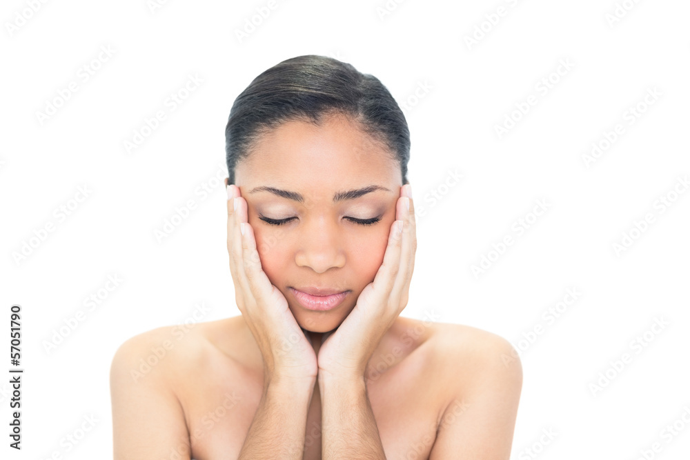 Peaceful young dark haired model closing her eyes Peaceful young dark haired model closing her eyes