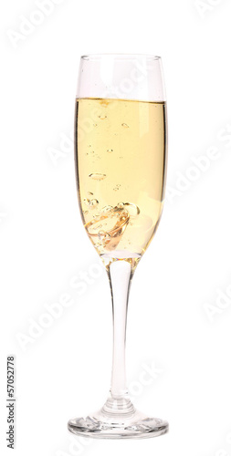 Glass of champagne with wedding rings.