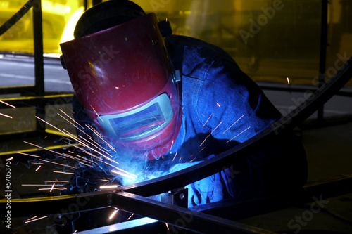man welding steel